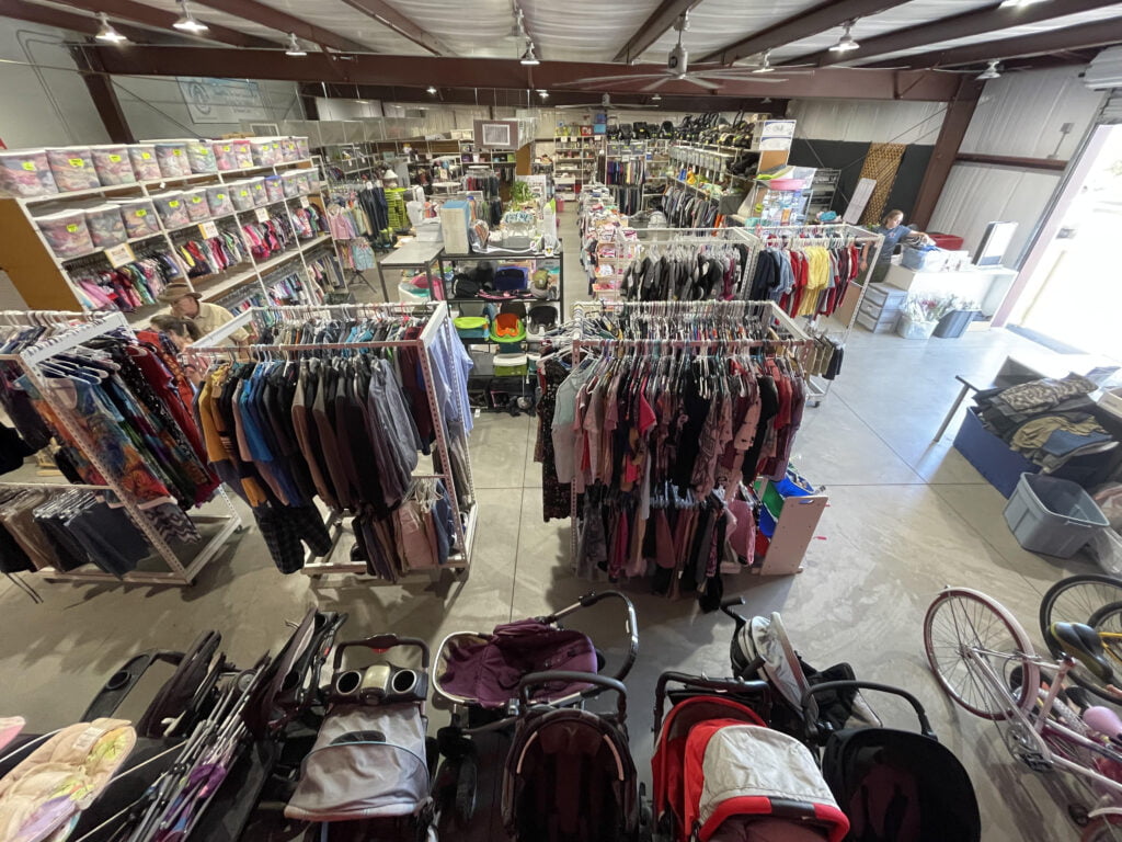 Aerial view of the warehouse, showing strollers, clothes, and other goods for foster families